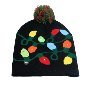 Close-up of black Christmas knit hat with LED lights, colorful bulb pattern, and red-green pompom