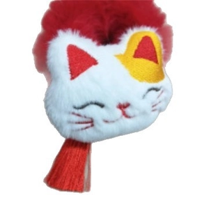 Plush Lucky Cat hair tie with festive red tassel and cute embroidered smiling face
