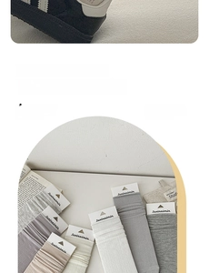 Detailed knit texture of breathable cotton mid-calf socks in Morandi tones with tags