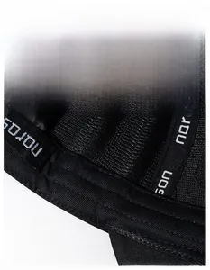 Macro shot of breathable mesh sweatband and logo webbing inside a black baseball cap