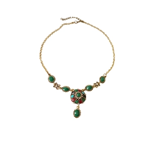 Vintage gold necklace set with green oval gemstones and multicolor floral pendant detail