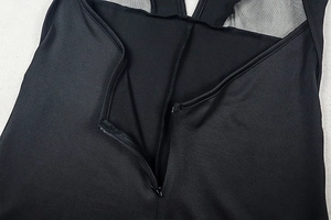 Close-up of black mesh stitching and invisible zipper detail on the back of bodysuit