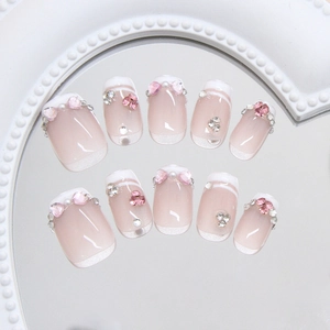 Handmade French press-on nails with pink heart rhinestones and elegant pearls