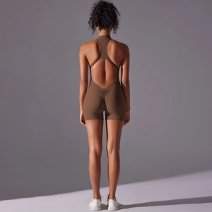 Detail of scrunch butt design and racerback on a dark brown fitness yoga bodysuit