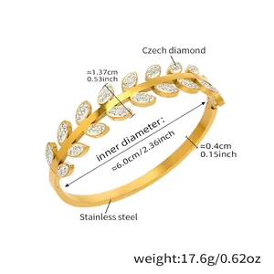 Detailed view of 18k gold plated leaf-shaped steel bracelet with sparkling zircons