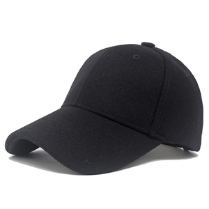 Detailed view of the thick wool felt texture and classic stitching of the black baseball cap