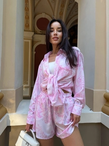 Women's two-piece pink floral loungewear set with long sleeve tied shirt and loose shorts