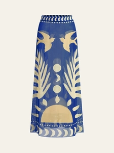 Detail of vintage bird and sun print on dark blue mesh fabric for long summer dress