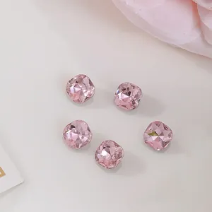 Detailed macro of 6x6mm pink square cushion-cut rhinestones for nail art and jewelry