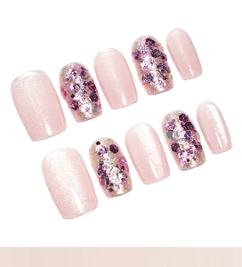 Detailed set of 10 pink cat eye press-on nails with purple glitter sequins decoration