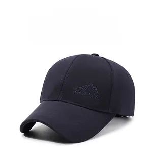 Close-up of embroidered SPORTS logo and mountain graphic on a navy baseball cap