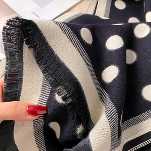 Retro navy blue polka dot scarf with beige borders and fringe tassels for winter warmth