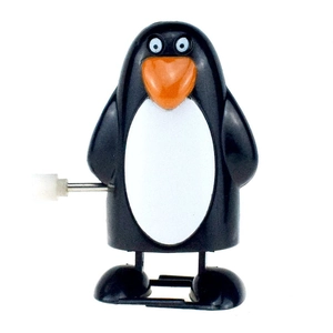 Wind-up penguin toy for Christmas, featuring a black and white body with orange beak
