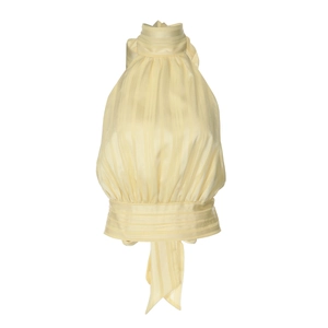 Detailed view of yellow halter neck top with satin-like vertical stripes and fitted hem