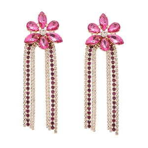 Elegant flower stud earrings with long purple and pink rhinestone tassels on white backdrop