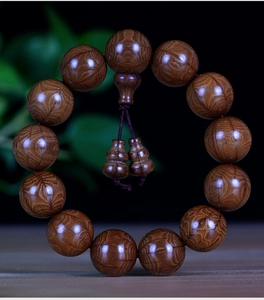 Macro detail of natural wood beads showing concentric rings and polished texture