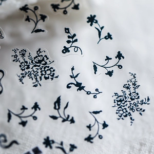 Lace black rose floral nail art stickers with vintage botanical patterns on plush fabric