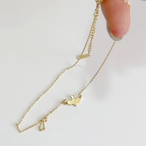 Handheld 925 sterling silver golden bird choker necklace with adjustable chain on white