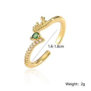 Detail of gold-plated adjustable ring with green pear-shaped stone and white zircons