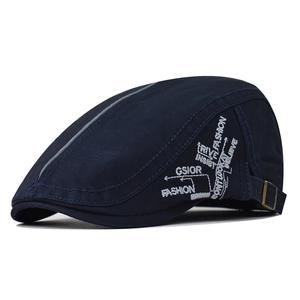 Detail of navy cotton flat cap with fashion embroidery and metal buckle closure