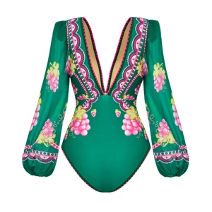 Detail of emerald deep V-neck swimsuit with puff sleeves and pink grape floral pattern