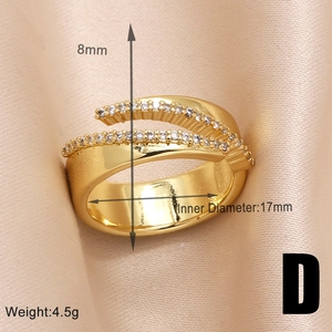 Macro view of gold-plated irregular crisscross ring with zircons and size parameters