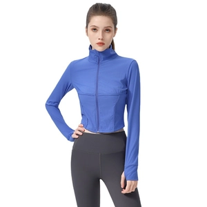 Slim fit blue long sleeve zip-up yoga jacket and grey high waist leggings for women