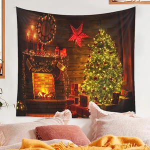 Detail of Christmas tree tapestry hanging above a cozy bed with warm pillows