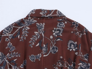 Macro shot of chiffon floral print detail with vertical texture and vintage shirt collar