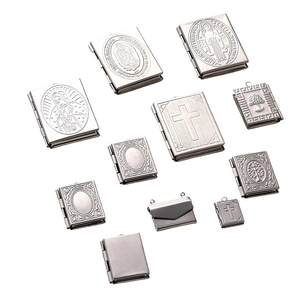 Detail of 316L stainless steel vintage book and envelope locket pendants with religious icons