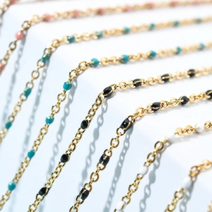 Bohemian style gold-plated beaded necklaces in black, turquoise, white and coral pink