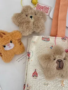 Star-shaped plush bag charms featuring embroidered bear, rabbit and alpaca animals