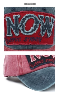 Close-up of distressed denim baseball cap with NOW embroidery and raw edges texture