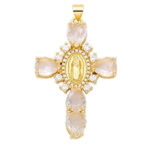 Macro detail of gold-plated cross pendant with Mary relief and sparkling cubic zirconia