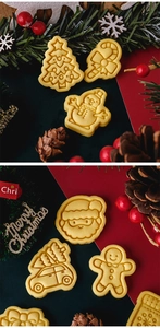 Close-up of Christmas cookie cutters with gingerbread man and festive shapes on a table