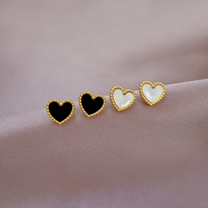 Minimalist titanium steel heart stud earrings in black and white with gold beaded edges