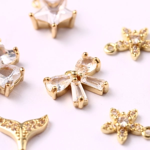Sparkling gold bow and star pendants with inlaid cubic zirconia for DIY jewelry making