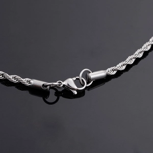 Detail of silver twisted rope chain with a sturdy lobster clasp for vintage pendants