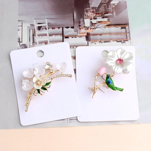 Vintage floral rhinestones and green enamel birds brooches on gold branches