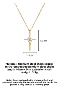 Detail of cross pendant with pink heart gemstone and zircon inlay on titanium steel chain