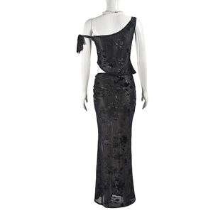 Detail of sheer black floral mesh long skirt featuring sexy backless design and lace texture
