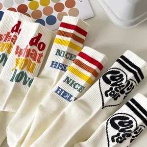 Set of white mid-calf cotton socks with colorful stripes and casual heart patterns