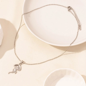 Detailed close-up of a silver jellyfish pendant necklace with an adjustable link chain