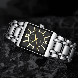 Macro view of square quartz watch with black dial, Roman numerals and silver metal strap