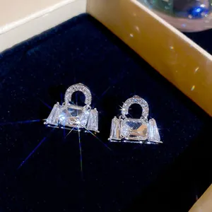 Sparkling silver bag-shaped stud earrings with rectangular zircon and pave crystals