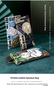 Detail of printed leather glasses pouches with art prints and iron shrapnel closure