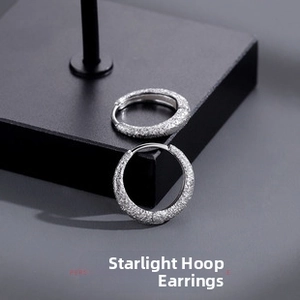 Detailed close-up of textured starlight finish on vintage hoop earrings for men and women