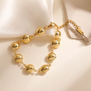 Polished 18K gold plated stainless steel bead bracelet with adjustable clasp