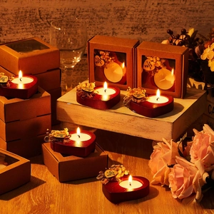 Detail of heart-shaped wooden candle gift set with dried flowers and thank you tag