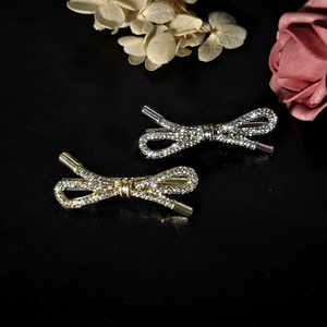 Sparkling rhinestone bow hair clips in gold and silver finish with elegant floral decor